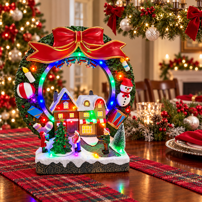 Musical Christmas wreath village on a plaid table runner with festive place settings and evergreen decorations