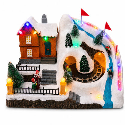 Christmas ski resort village with a snowy house, mountain tunnels and miniature train on a white background