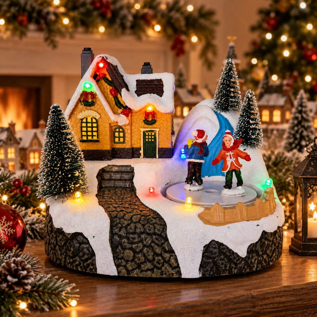 Battery-operated Christmas village music box with skating figures, cottage and frozen waterfall
