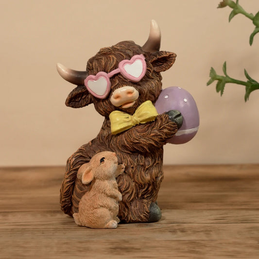 Highland Cow Holding Easter Egg Figurine with Bunny Spring Garden Decor