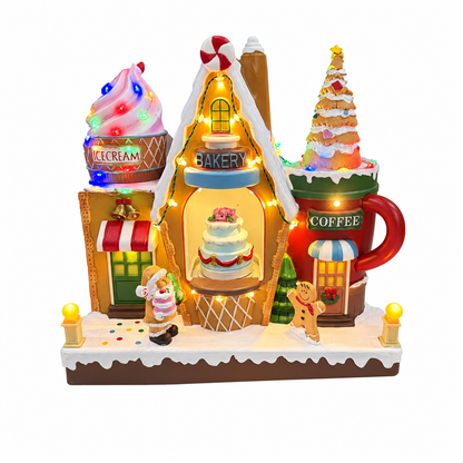 Musical Christmas bakery and ice cream shop with rotating cake, golden cookie tree, Santa and gingerbread figure on a white background