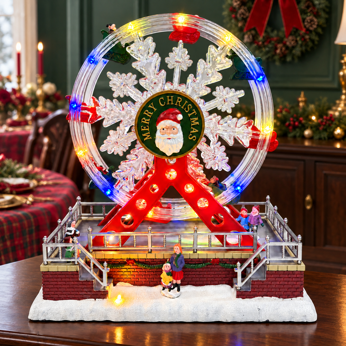 Rotating Santa Ferris wheel on a wooden sideboard in a red and green Christmas dining room