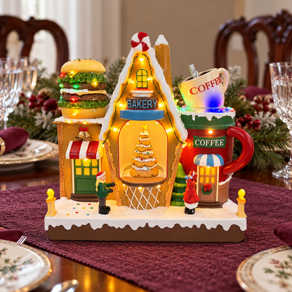 Lighted Christmas bakery and coffee shop on a holiday dining table with burgundy linens and festive place settings